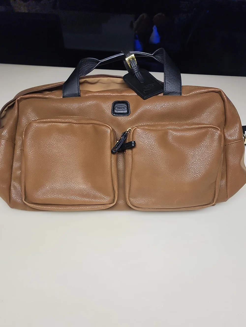 Bric's Tan Duffel with Black Handles and Gold Accent